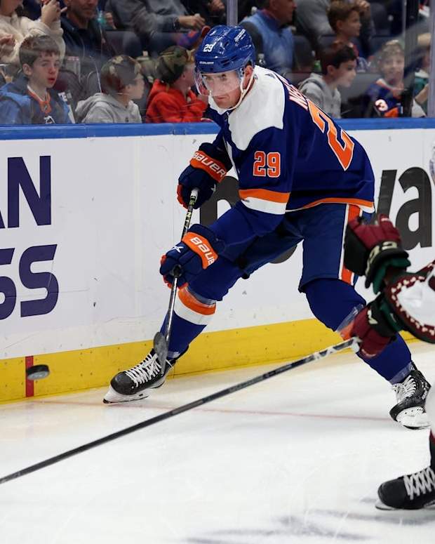 Nov 10, 2022; Elmont, New York, USA; New York Islanders center Brock Nelson (29) controls the puck against Arizona Coyotes left wing Matias Maccelli (63) during the first period at UBS Arena. Mandatory Credit: Brad Penner-USA TODAY Sports